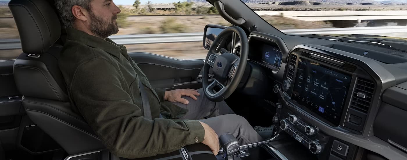 A man is using the Hands Free driving feature in a 2025 Ford F-150