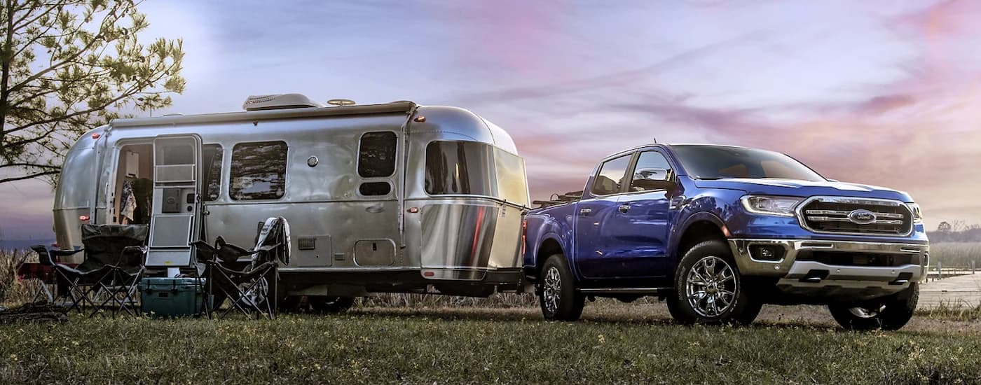 Blue 2023 Ford Ranger Lariat parked at a campsite
