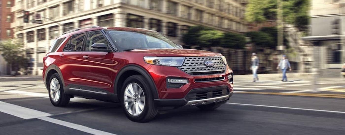 A maroon 2023 Ford Explorer from the side.