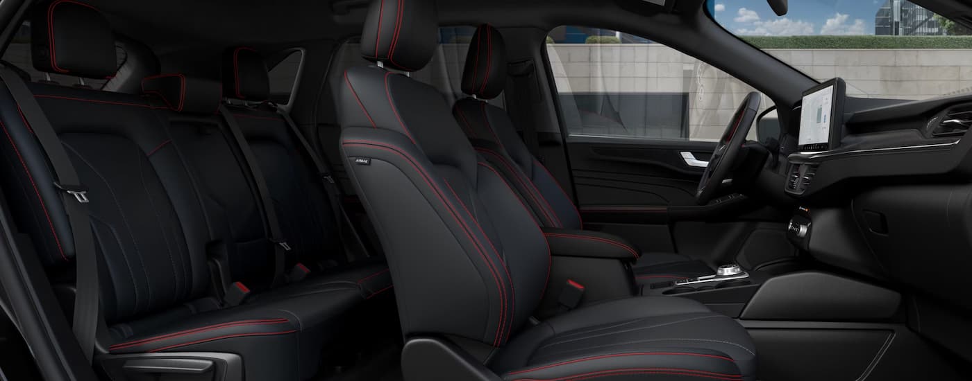 Black and red accented interior of a 2025 Ford Escape.