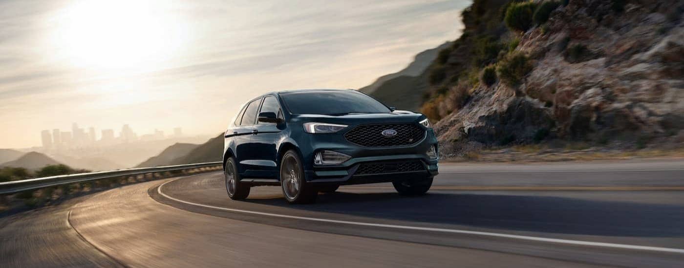 A green 2024 Ford Edge is shown driving after viewing a used Ford for sale.
