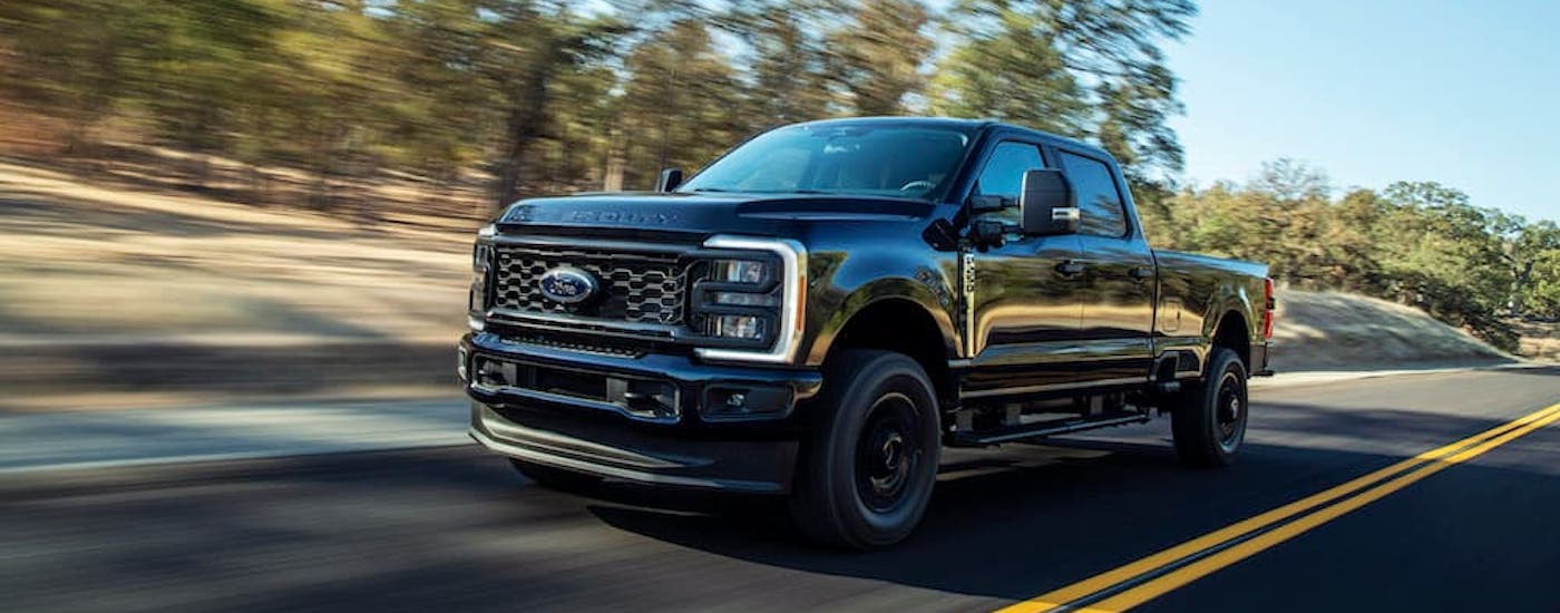 A black 2025 Ford F-250 for sale near Defiance is shown from the front at an angle.
