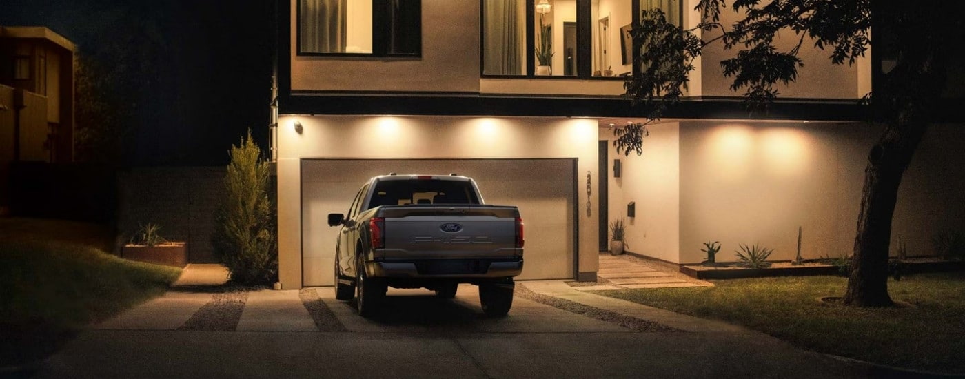 A silver 2025 Ford F-150 XL is shown parked on a driveway.