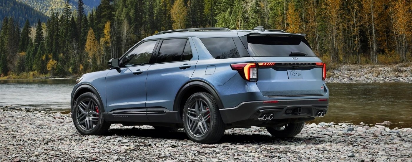 Blue 2025 Ford Explorer ST parked by water