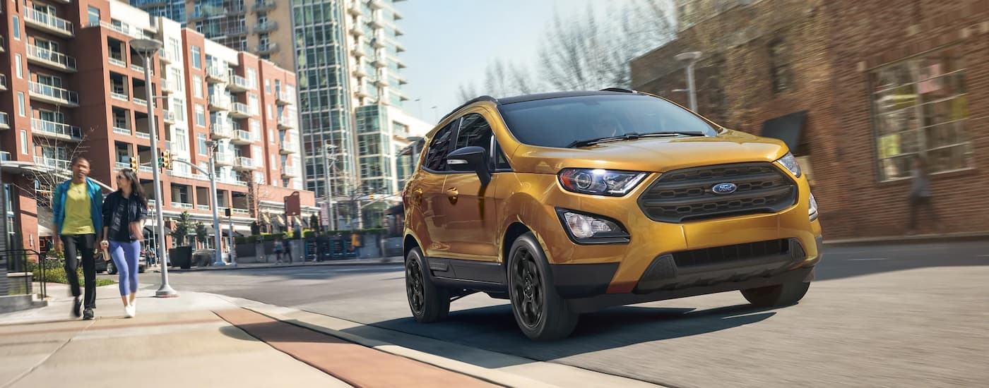 Gold 2022 Ford EcoSport parked on the side of a city street