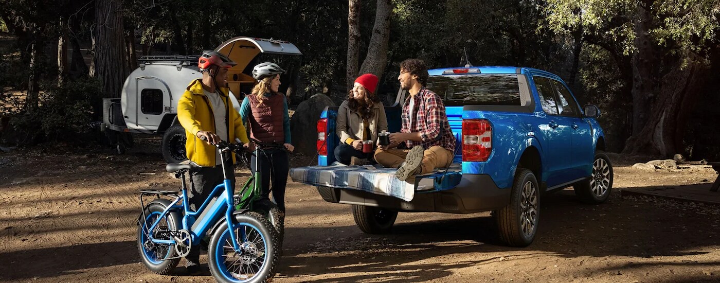 Blue 2022 Ford Maverick parked at a campsite
