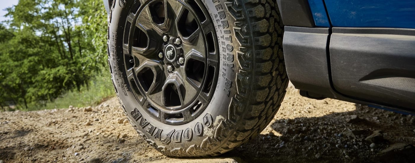 Close-up of a wheel on a blue 2025 Ford Bronco Sport.