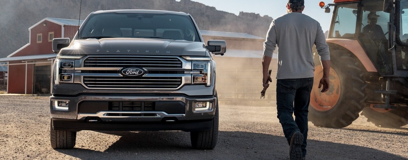 Silver 2026 Ford F-150 Platinum parked on a farm