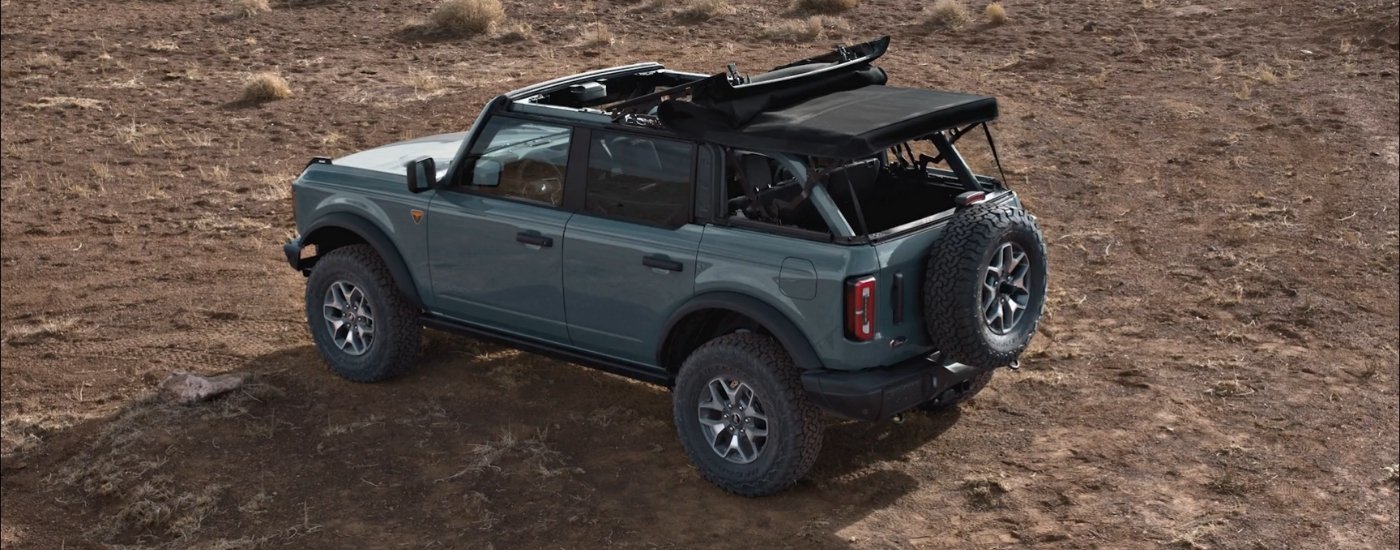 Blue 2026 Ford Bronco parked off-road from the rear