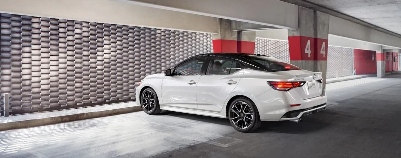 A white 2025 Nissan Sentra SR parked in a parking garage.