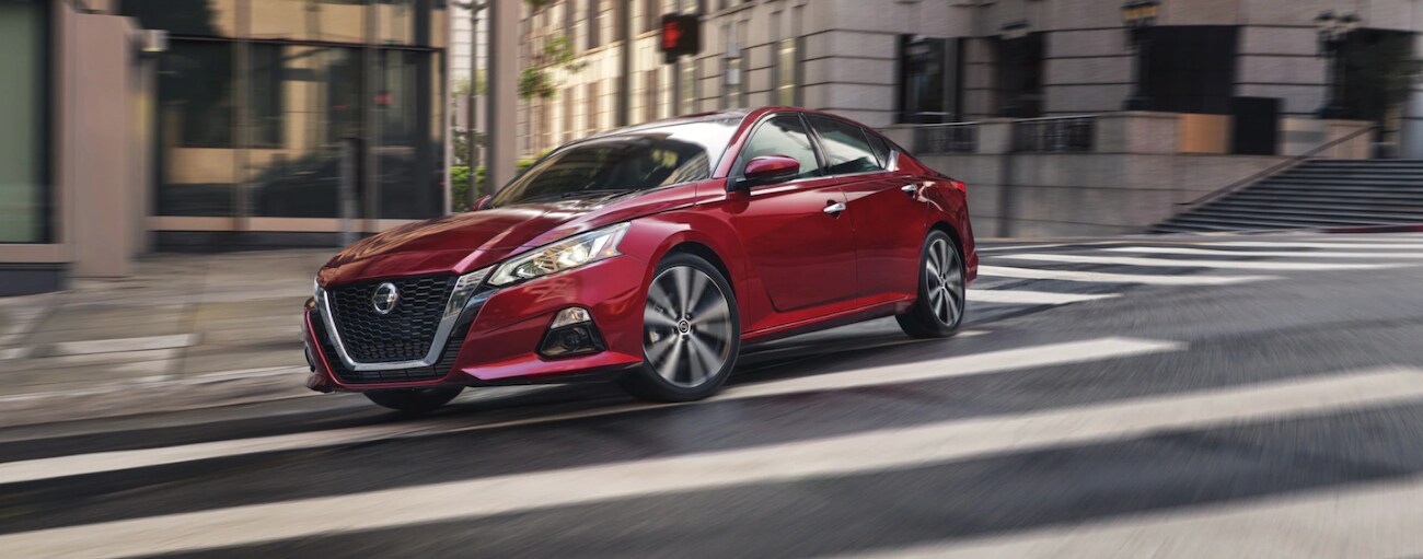 A red 2022 Nissan Altima from the front after leaving a dealer that has a used Nissan for sale near Van Wert.