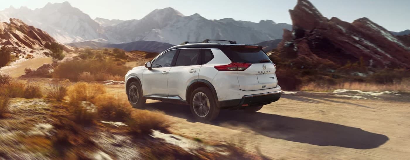 A white 2025 Nissan Rogue off-roading.