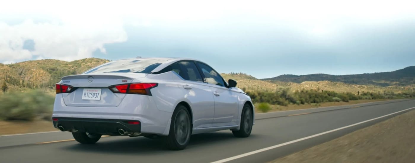 A white 2026 Nissan Altima from the rear at an angle.