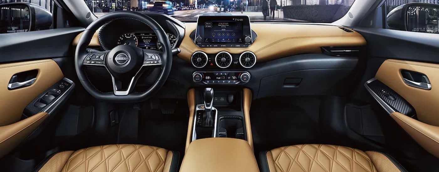 The black and tan interior and dash in a 2025 Nissan Sentra.