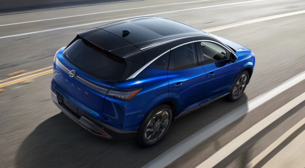 Overhead view of a blue 2025 Nissan Murano Platinum driving on a highway.