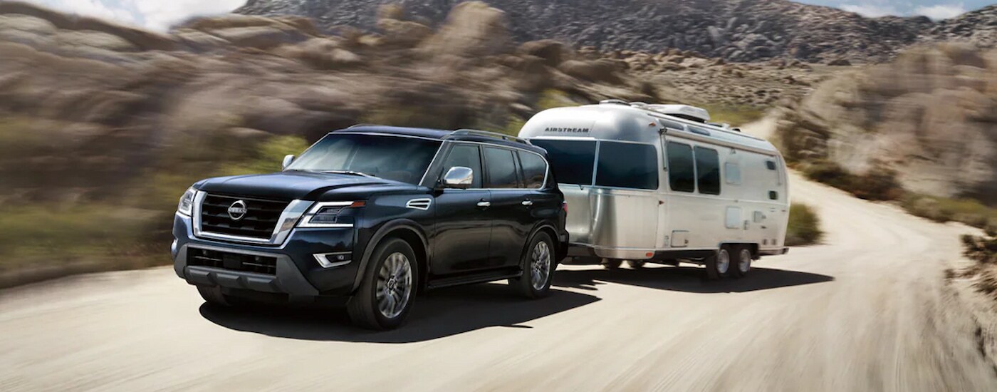 2024 Nissan Armada Platinum towing an Airstream trailer.