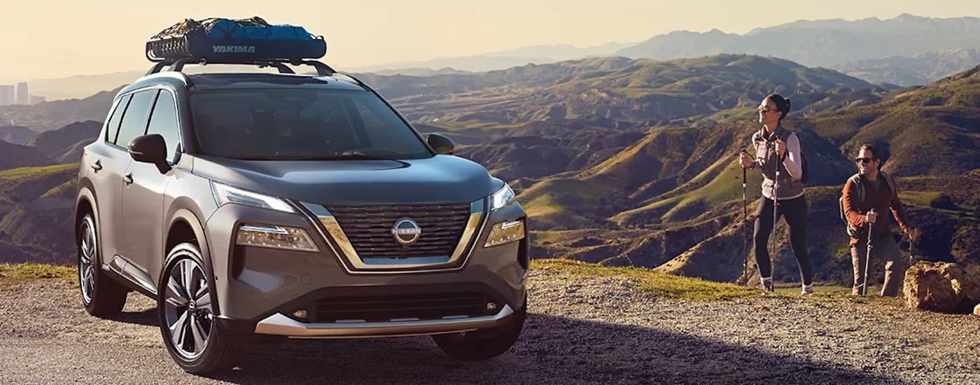 A silver 2023 used Nissan Rogue for sale from the front.