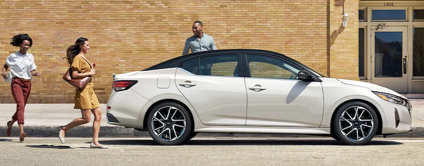 A white 2024 Nissan Sentra is shown parked after visiting a Nissan dealer near Sidney.