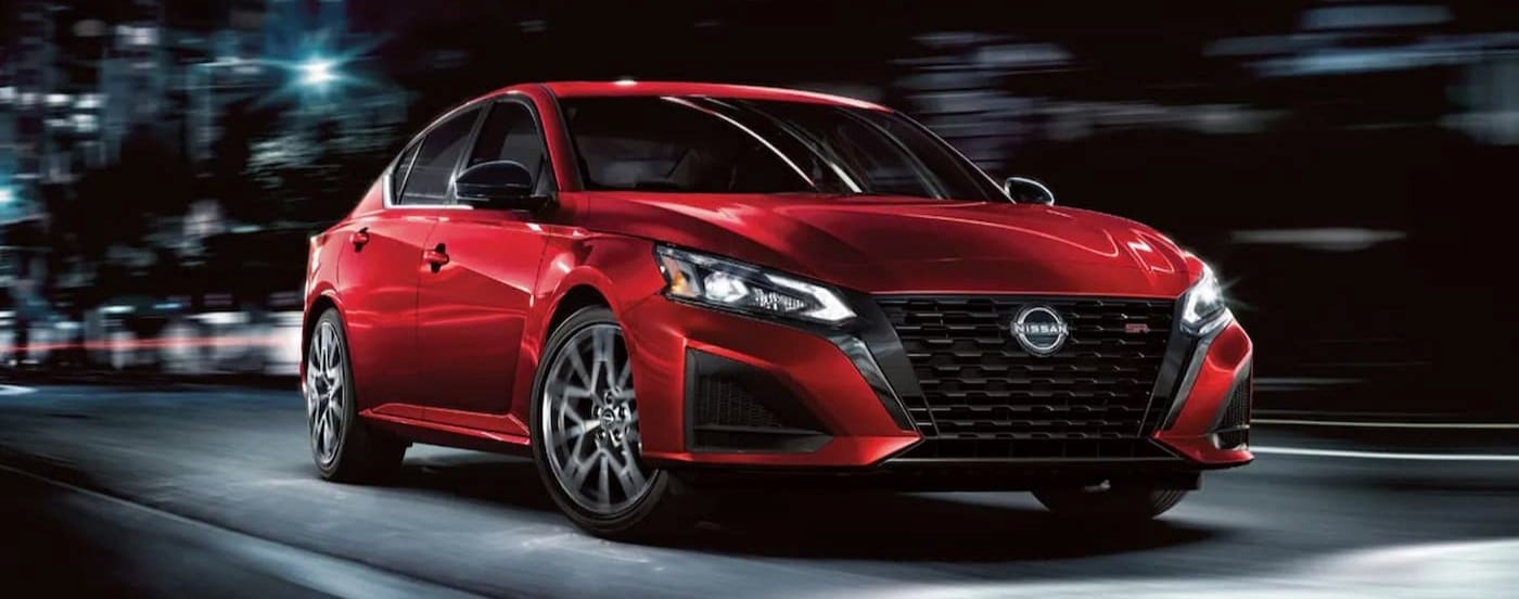 A red 2024 Nissan Altima SR is shown driving to visit a Nissan dealer near Wapakoneta.