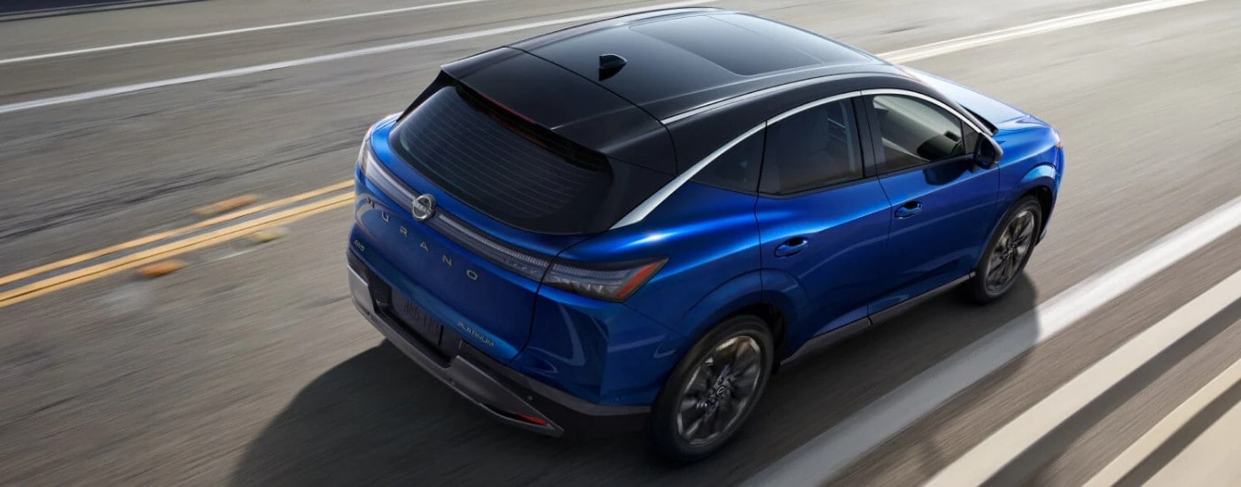 A blue 2025 Nissan Murano for sale in Lima from the rear at an angle.