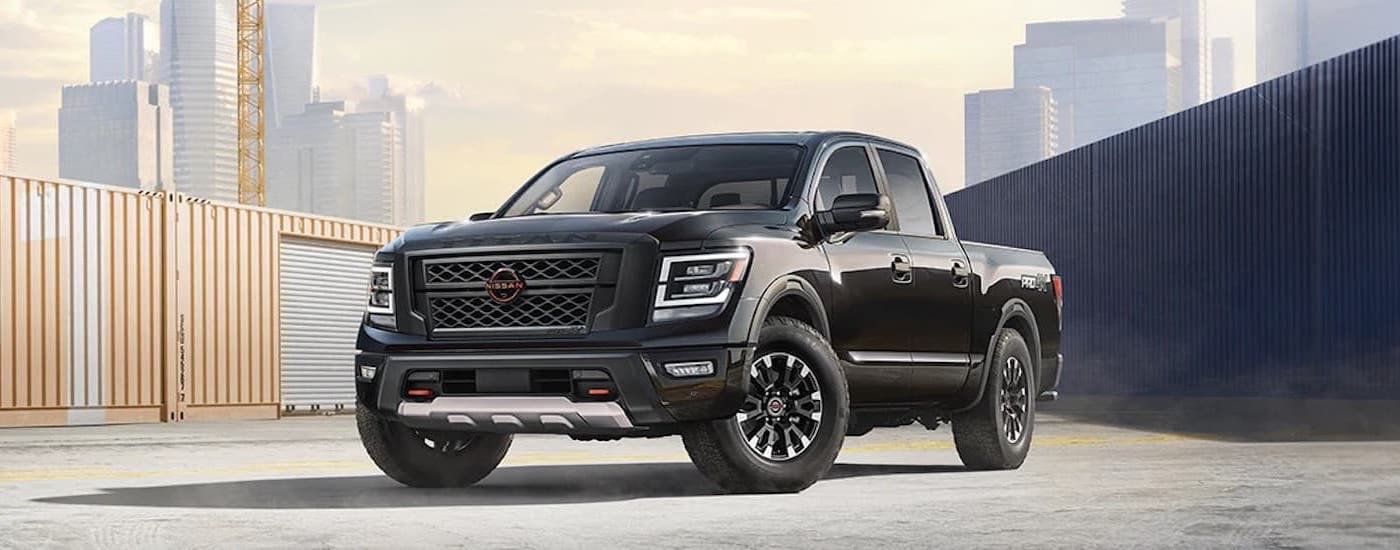 A black 2024 Nissan Titan Pro-4x is shown from the front at an angle.