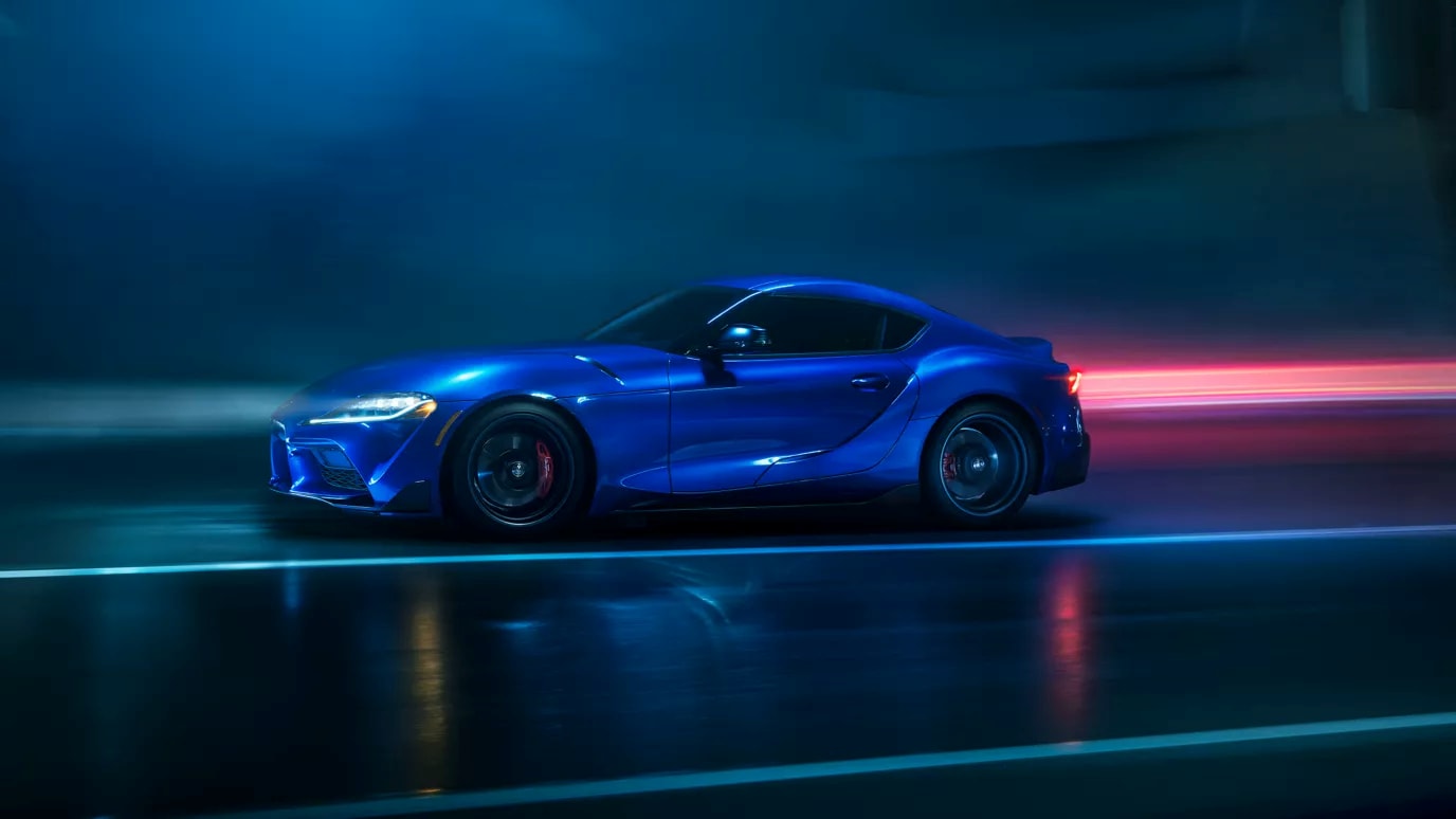2026-toyota-gr-supra-side-view-driving-in-dark-tunnel.png