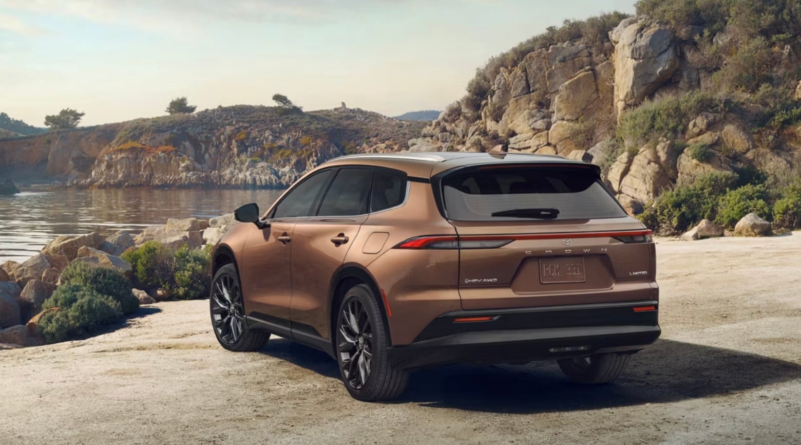  The outside, rear of the 2026 Crown Signia in brown parked in Greensboro PA, overlooking a lake.