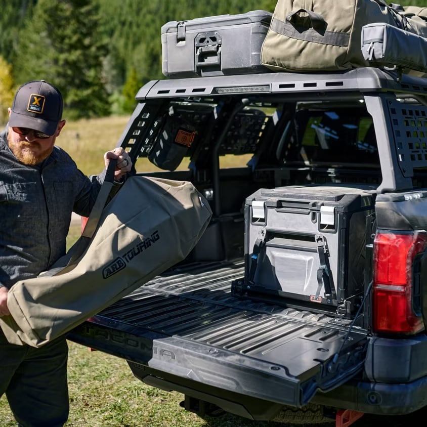  Person cheerfully signing documents.
