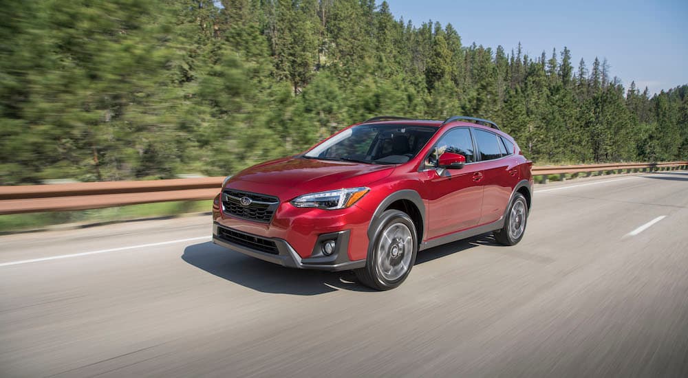 Subaru Crosstrek Dealer - 2018 Subaru Crosstrek Limited - Red.jpg A red 2018 Subaru Crosstrek Limited is shown driving on a tree-lined road.