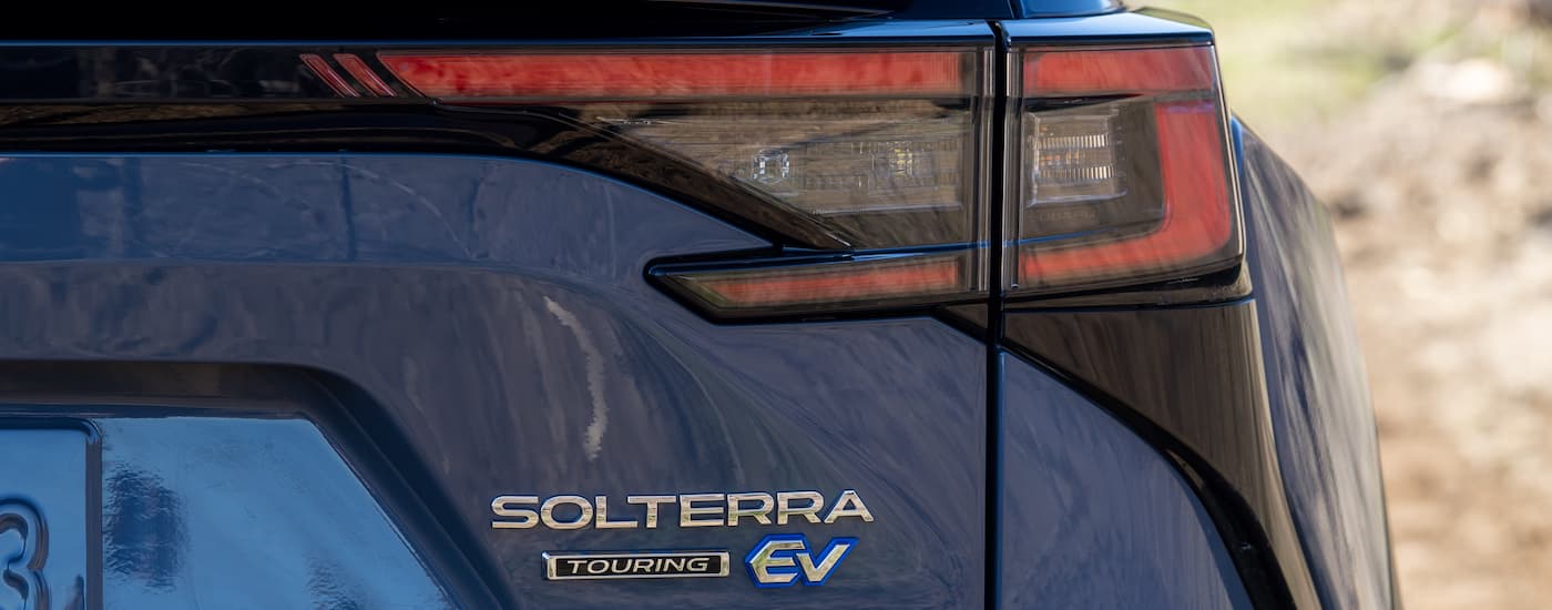 Subaru Solterra Dealer in NJ - 2023 Subaru Solterra Touring - Badge.jpg A close up shows the badging on the trunk of a blue 2023 Subaru Solterra Touring.