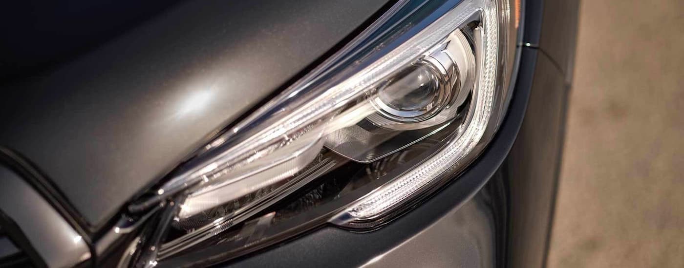 A close up shows the driver side headlight on a grey 2022 Subaru Ascent from a high angle.