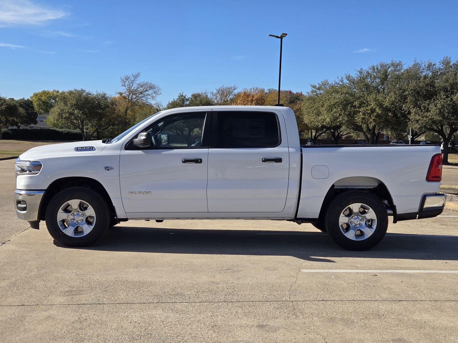 New 2026 Bright White Ram LONE STAR CREW CAB 4X4 5