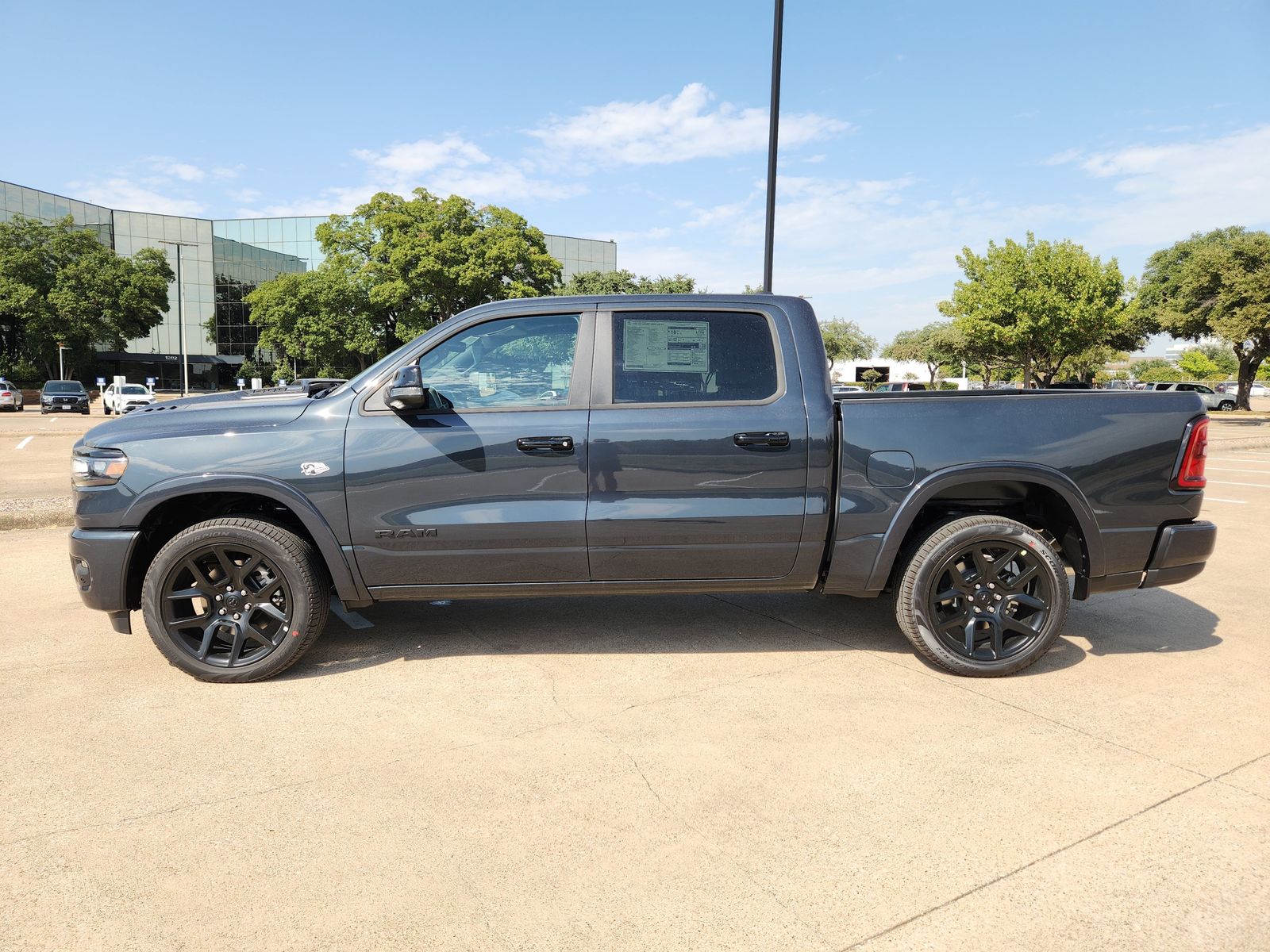 New 2026 Forged Blue Ram LARAMIE CREW CAB 4X4 5