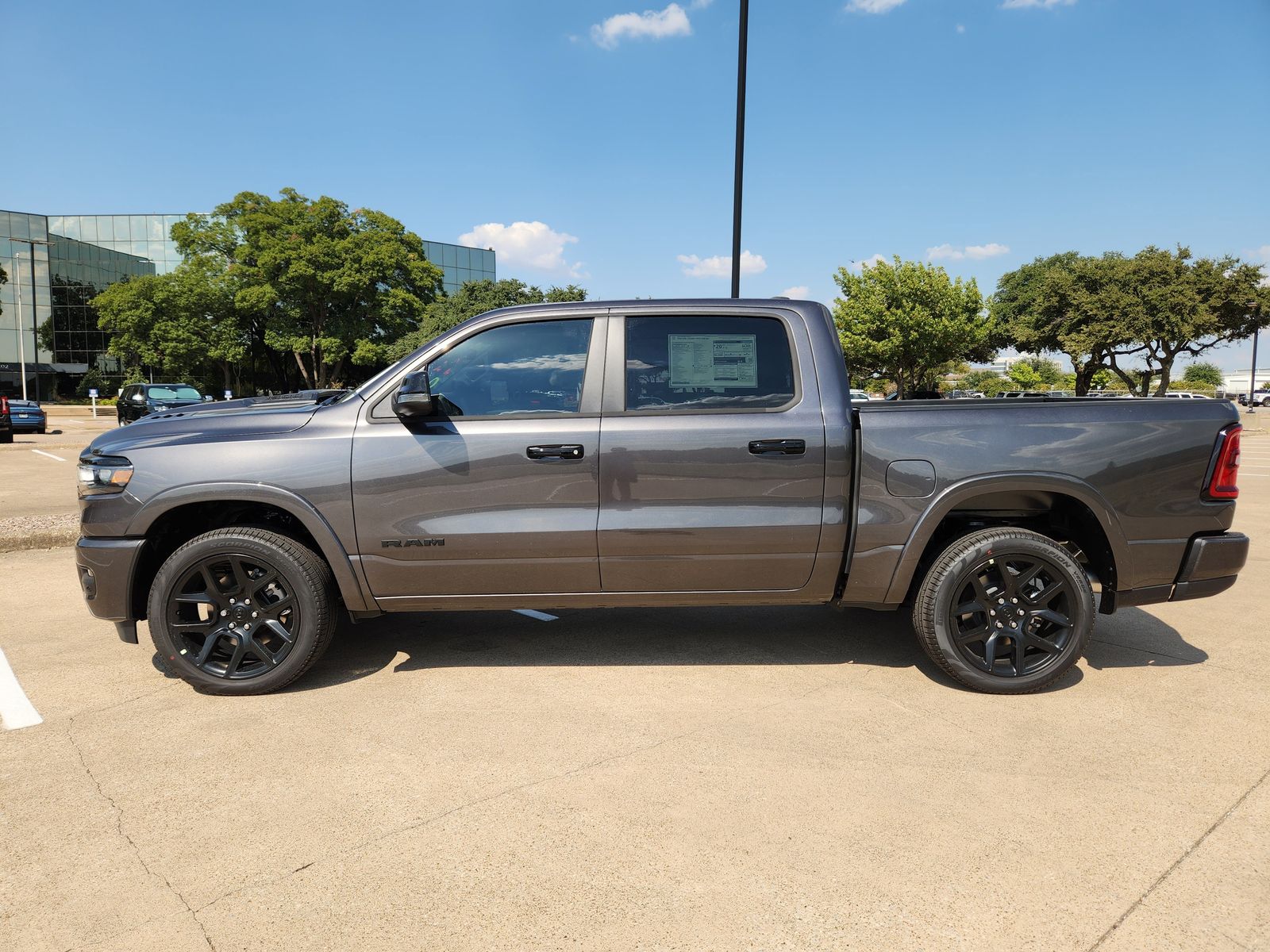 New 2026 Granite Crystal Ram LARAMIE CREW CAB 4X4 5