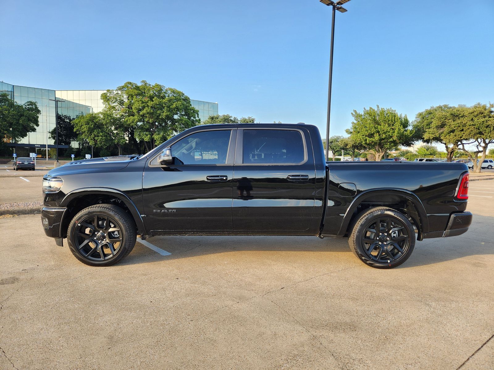 New 2026 Diamond Black Crystal Pearlcoat Ram LARAMIE CREW CAB 4X4 5