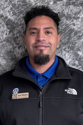 Staff member Joel Badio from 3155fe530c06