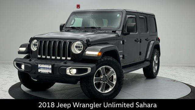 Used 2018 Jeep All-New Wrangler Unlimited Sahara with VIN 1C4HJXEG2JW242060 for sale in Bronx, NY