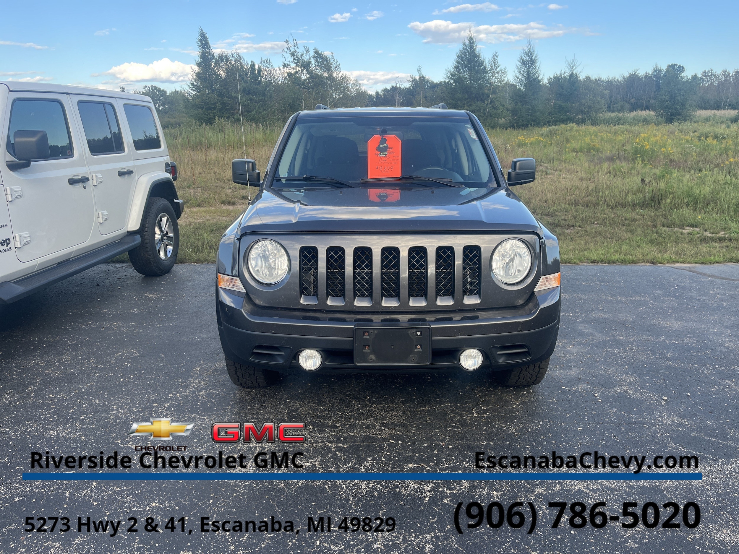 Used 2014 Jeep Patriot Latitude with VIN 1C4NJPFB1ED893977 for sale in Escanaba, MI