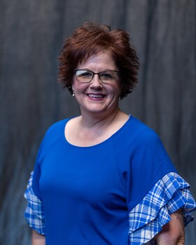 Staff member KAT MUZNY from 7004c08575f9