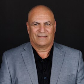 Staff member John Azad from e6451e03389f