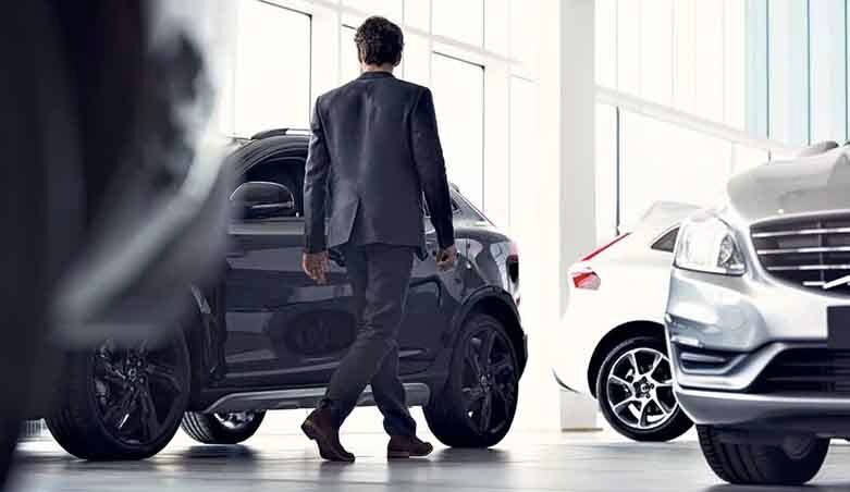 Man Shopping for Volvos