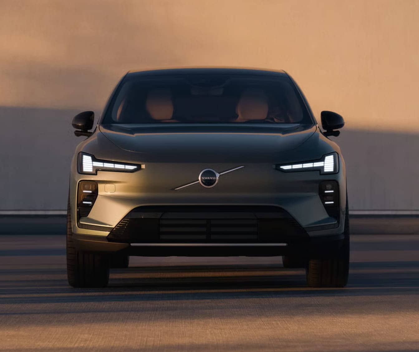 Front view of a sleek, 2026 Volvo EX40. The car is set against a neutral background.