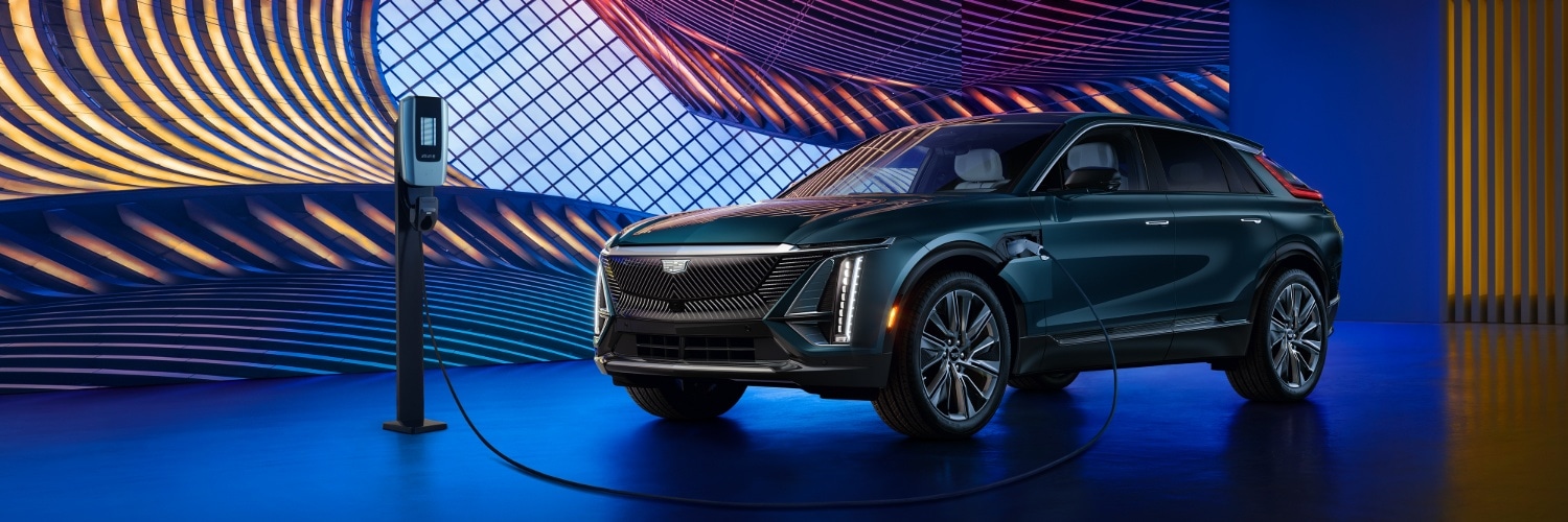 Cadillac LYRIQ Cadillac LYRIQ charging near a modern house