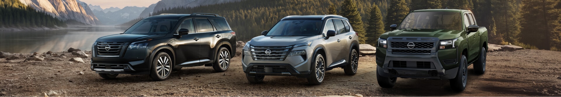 A black Nissan Pathfinder, gray Nissan Rogue and green Nissan Frontier parked in a mountain clearing.