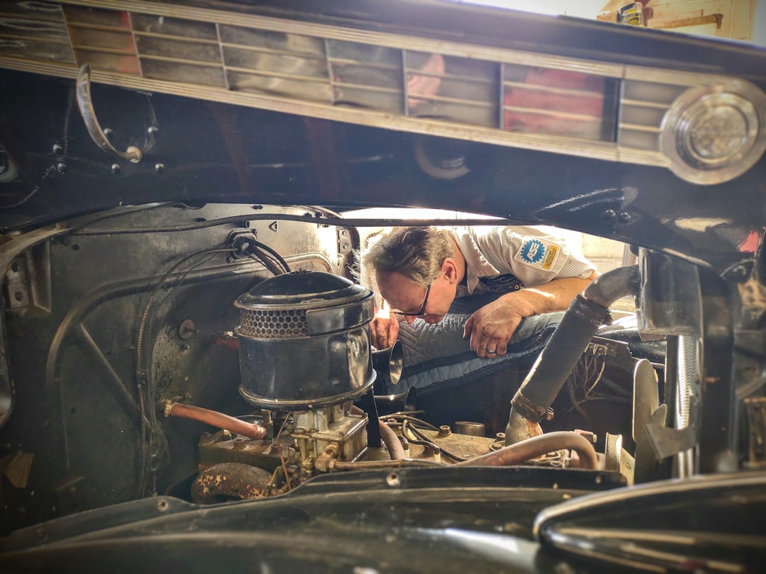 certified technician working on a Hyundai engine in a clean service bay - hyundai dealership milwauk…