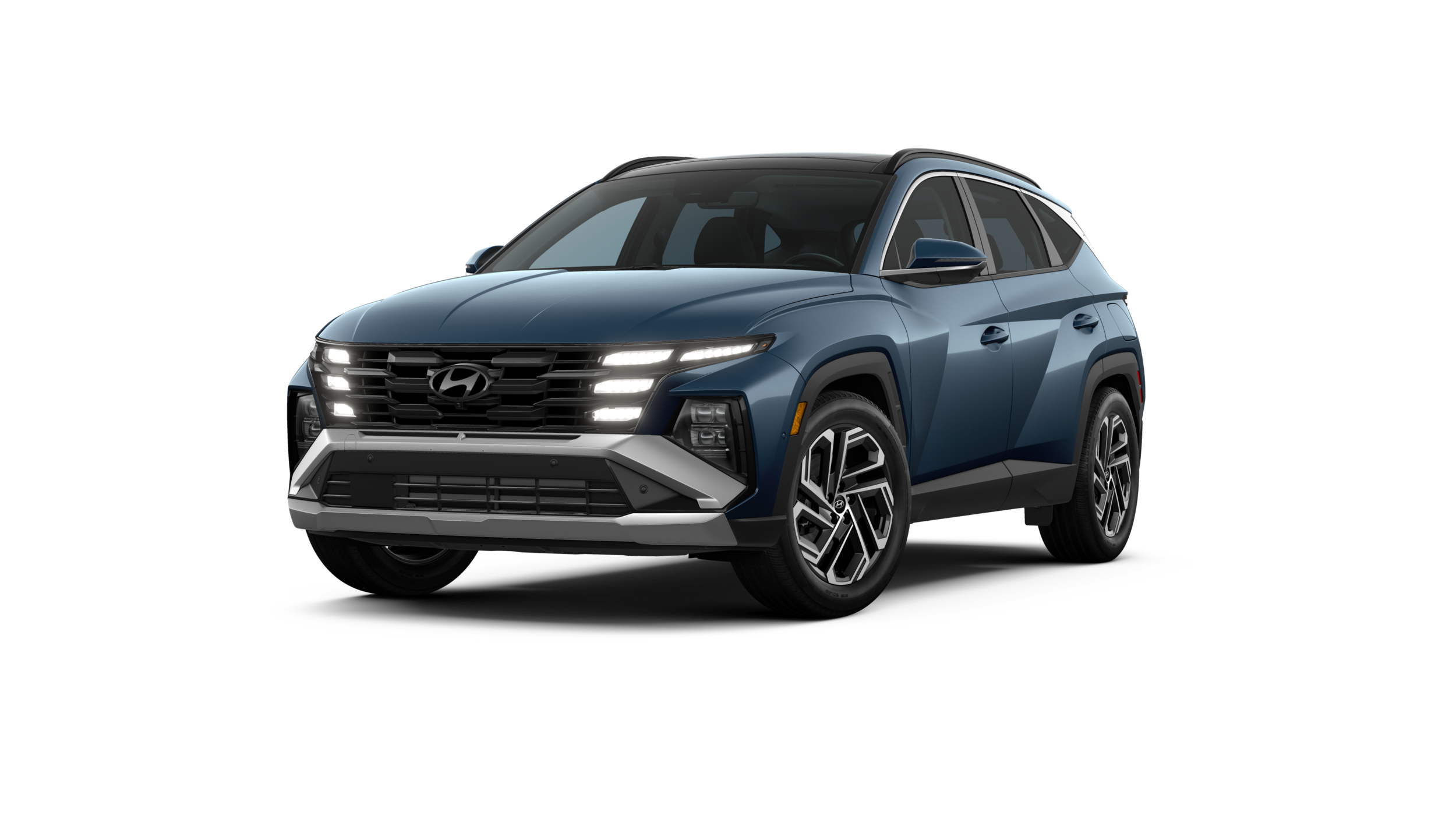 2025_Tucson_LTD_AWD_AtlantisBlue_Black_FrontDrvrAngleWheelTurnDrlOn_WhiteStudio.png