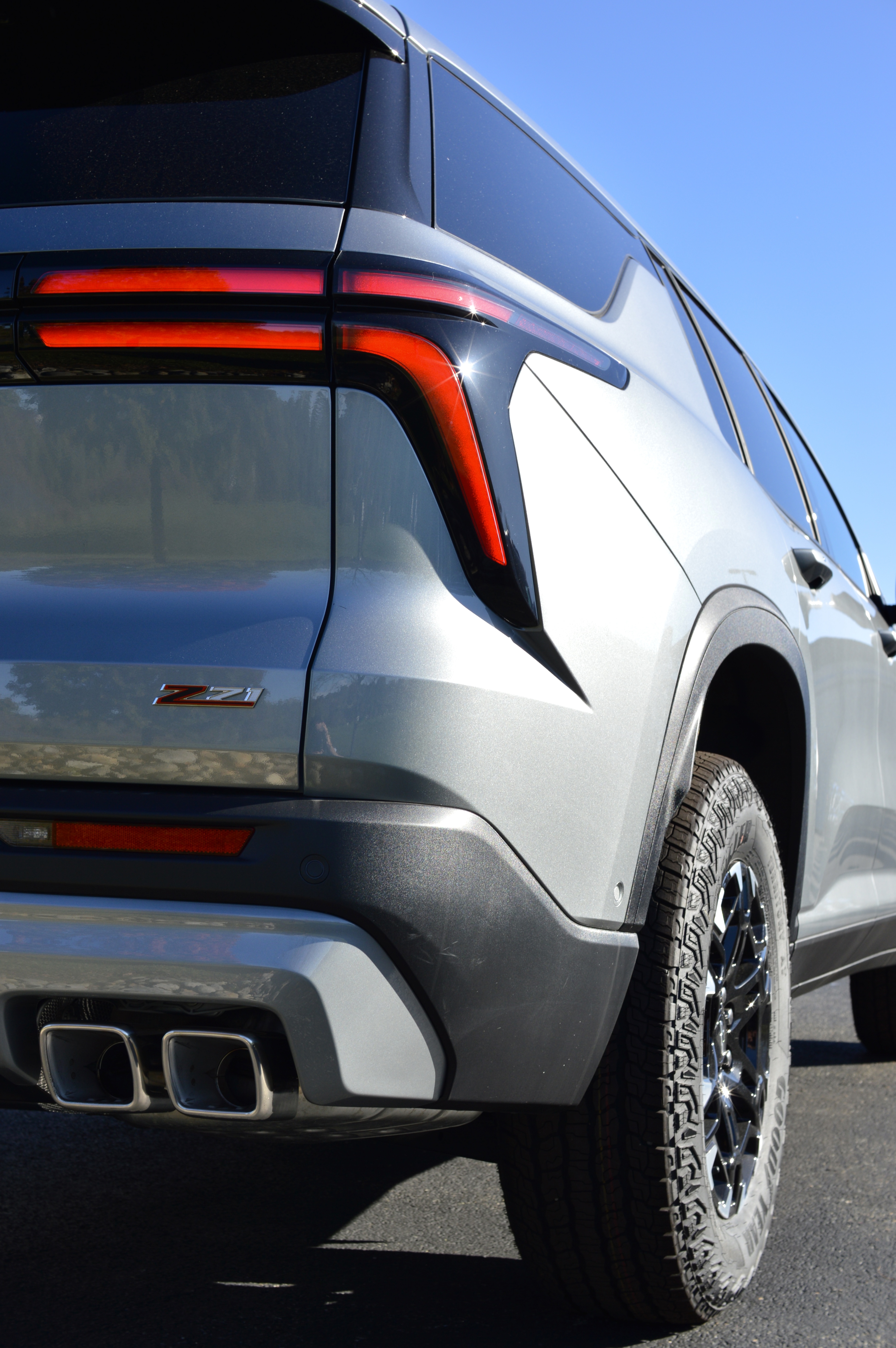 Rear three-quarter detail of the silver Traverse Z71 showing its taillamp and rear wheel