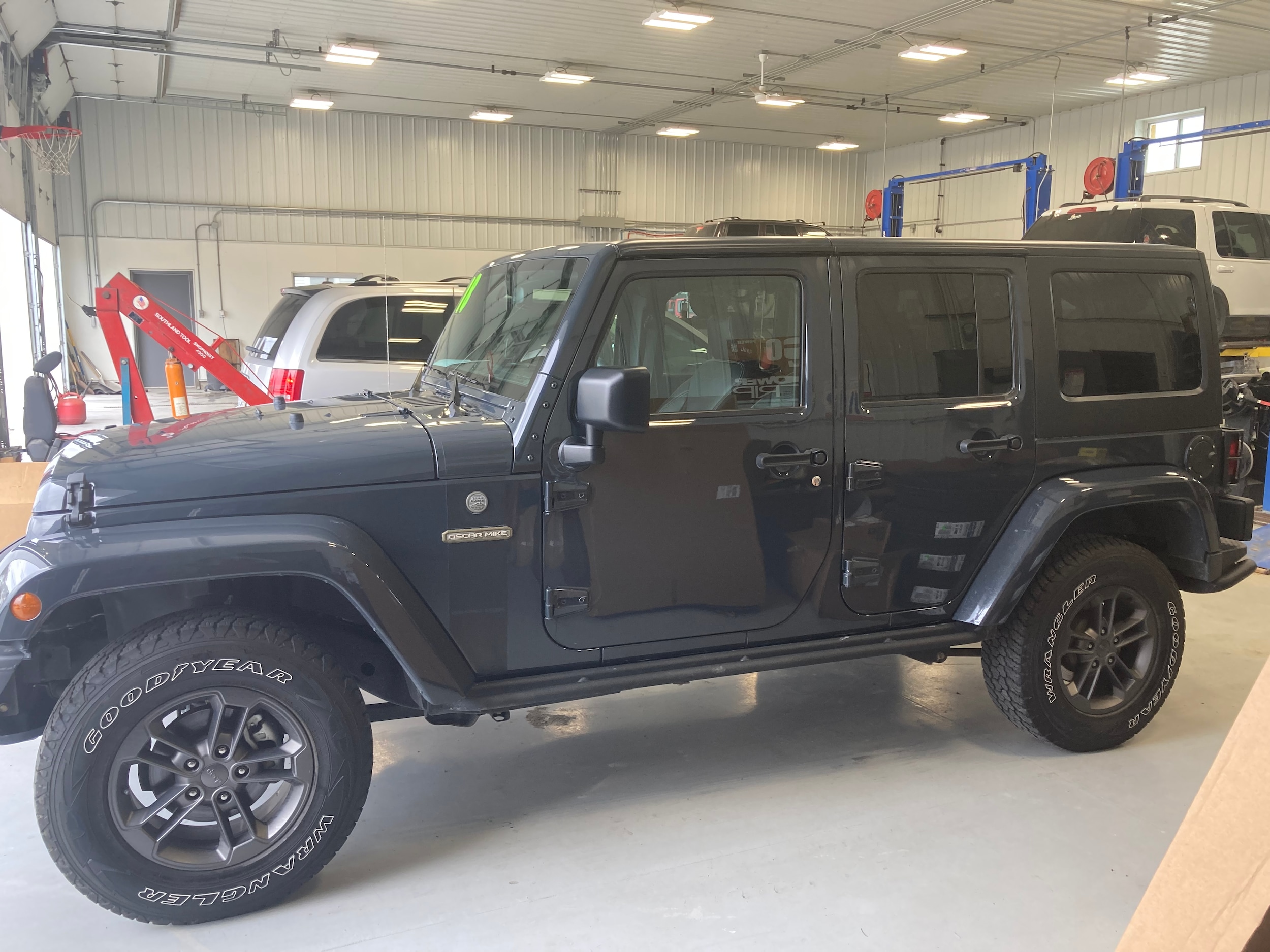 Certified 2018 Jeep Wrangler JK Unlimited Freedom Edition with VIN 1C4HJWDG4JL825758 for sale in Grundy Center, IA