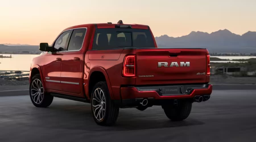 A premium red 2026 Ram 1500 Tungsten 4x4 truck with polished luxury alloy wheels, featured in the new vehicle inventory at Route 18 Autos in East Brunswick, New Jersey.