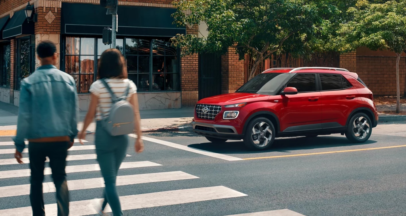 Red 2026 Hyundai Venue crosswalk street view.